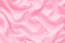 a close up of a pink satin fabric