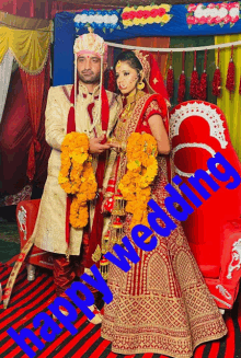 a bride and groom are posing for a picture with the words happy wedding in blue