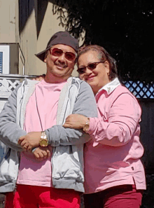 a man and a woman are posing for a picture together