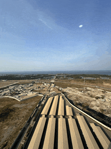 an aerial view of a building with a blue sky