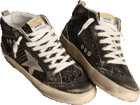 a pair of black golden goose sneakers