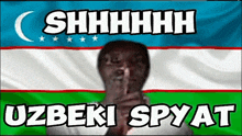 a man covering his mouth in front of a flag that says shhhh uzbeki spy at