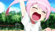 a little girl with pink hair is screaming with her mouth open and her hands in the air .