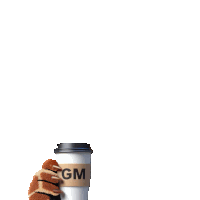 a gm coffee cup with a stuffed animal holding it