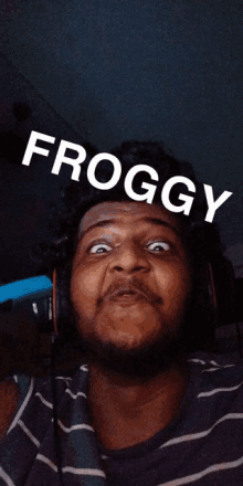 a man is wearing headphones and making a funny face with the word froggy above him