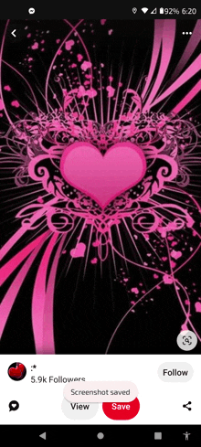 a screenshot of a pink heart on a black background on a phone .