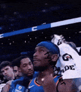 a basketball player wearing a headband and a gatorade shirt