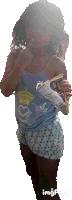 a little girl wearing a blue tank top with a crown on it is holding a bag of chips