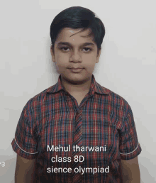 a boy wearing a plaid shirt is named mehul tharwani class 8d sience olympiad