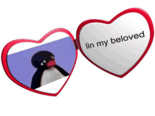 two heart shaped mirrors with a picture of a penguin and the words " in my beloved "