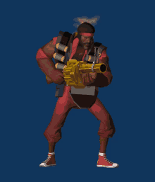 a man in red shorts is holding a large gun