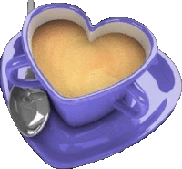 a purple heart shaped cup of coffee with a spoon on a saucer