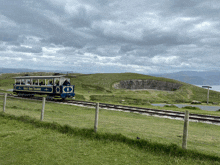 a blue and yellow trolley with the word ireland on the side