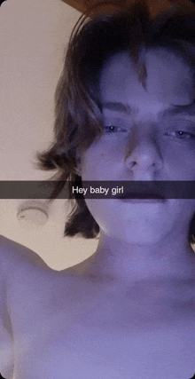 a snapchat of a shirtless young man with a caption that says hey baby girl