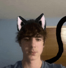 a young man with cat ears on his head