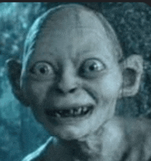 a close up of a gollum from the lord of the rings making a face .