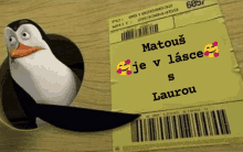 a penguin is sticking its head out of a hole next to a package that says ' matous je v lasce '