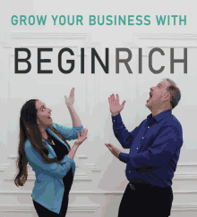 a man and a woman giving each other a high five in front of a sign that says grow your business with beginrich