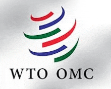 the logo for the world trade organization is a circle with red , blue , and green stripes .