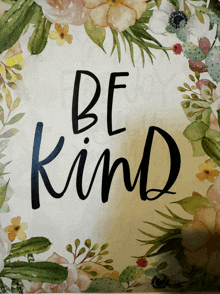 a sign that says be kind on it