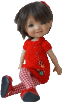 a doll wearing a red top and plaid pants