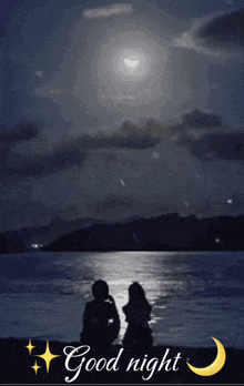 a man and a woman sit on the beach at night with the words good night below them