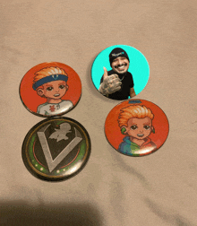 four buttons with cartoon characters on them one of which has a thumbs up