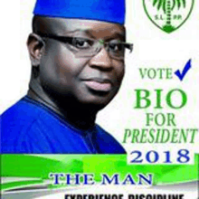 a man wearing glasses and a blue hat is on a poster that says vote bio for president 2018 .