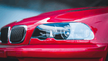 a close up of a red bmw headlight