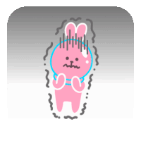 a pink bunny with a blue circle around its neck is standing in the dark