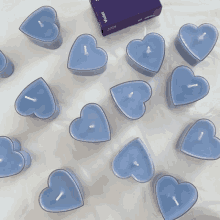 a box of purple candles in the shape of a heart