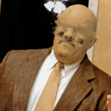 a man in a suit and tie has a blurred image of his face