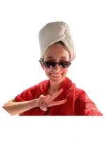 a woman with a towel wrapped around her head is wearing sunglasses and a red robe