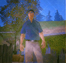 a man in a blue shirt and white pants is standing in front of a fence with trees in the background