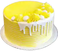 a yellow and white cake with yellow frosting and white frosting dripping down the side