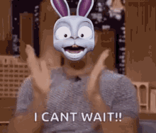 a man wearing a bunny mask with the words `` i can t wait '' .