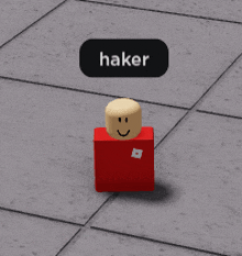 a red block with a smiley face and the word hacker on it