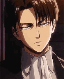 levi ackerman from attack on titan is wearing a suit and tie and looking at the camera .