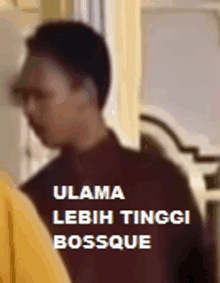 a blurry picture of a man with the words " ulama lebih tinggi bossque " on it