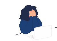 a woman is covering her face with her hands while sitting in front of a laptop .