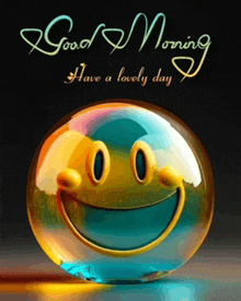 a glass ball with a smiley face and the words good morning have a lovely day below it