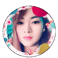 a woman 's face is in a circle with flowers and butterflies around it