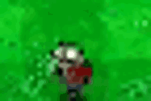 a blurred image of a cartoon character in a red shirt standing in the grass .