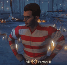 a man wearing a red and white striped shirt with the words viii panther ii on his waist