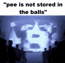 a group of people standing in front of a screen with the words " pee is not stored in the balls "