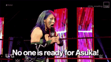 a woman in a wrestling ring says no one is ready for asuka !