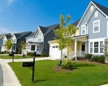 a row of houses sitting next to each other in a residential neighborhood .