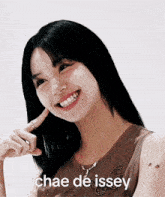 a woman is smiling with the words chae de issey above her head