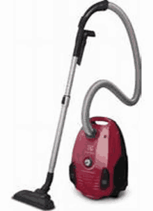 a red vacuum cleaner with a hose attached to it is sitting on a white surface .