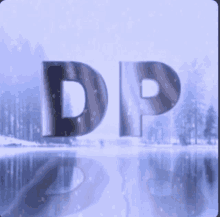 the letters dp are displayed in front of a lake